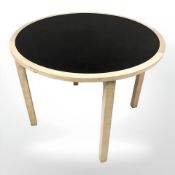 A contemporary Danish oak melamine inset circular table,