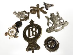 A small group of military cap badges, silver Machine Gun Corps enameled sweetheart brooch, etc.