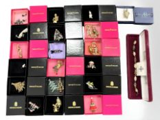 Eighteen Butler & Wilson brooches/key chains in boxes together with a further Adrian Buckley brooch