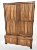 A 20th century Danish teak and ply double door cabinet,