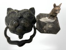 A ceramic ash tray surmounted by a cold painted metal figure of a dog,