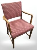 A continental teak framed armchair