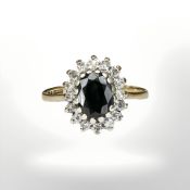 A 9ct yellow gold sapphire and diamond cluster ring, size H/I CONDITION REPORT: 1.9g.