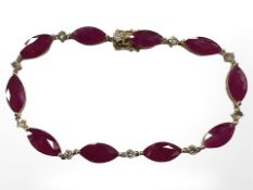 A 14ct yellow gold ruby and diamond bracelet, set with ten marquise-cut rubies (14.