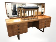 A 20th century teak mirror backed dressing table,