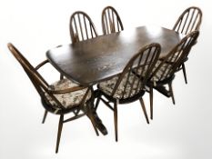 An Ercol stained elm dining table,