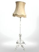 A painted wrought iron standard lamp.