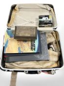 A suitcase containing fur coat, large atlases, a Victorian parquetry caddy, Fujifilm digital camera.