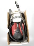 Two Nilfisk vacuum cleaners.