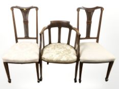 A pair of mahogany satin wood inlaid salon chairs and a further armchair
