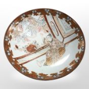 A late 19th century Japanese Kutani porcelain plate, signed to reverse, diameter 21.