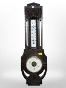 A 19th century German carved oak barometer, by Emil Willer, length 56 cm.
