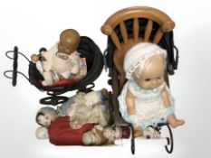 A group of antique and later dolls, including a porcelain headed example,
