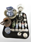 A group of ceramic soldier figurines, West German porcelain timepiece, candlestick,