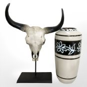 A large West German pottery vase, height 44 cm, and a resin cow skull on stand.