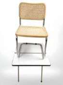 A melamine topped drop leaf table and a cantilever chair