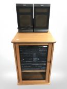 A teak entertainment cabinet containing Philips compact disc stereo midi system and speakers