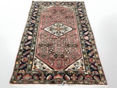 A Hamadan rug, North-West Iran, 221 cm x 138 cm.