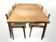 A 20th century teak pullout extending dining table with internal leaf,