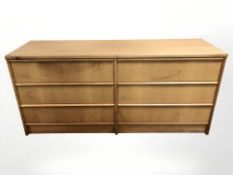 A teak and MDF six drawer chest,