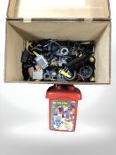 A wooden box containing assorted LEGO.