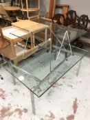 A pair of contemporary glass topped coffee tables, largest 110 cm x 70 cm x 46 cm.