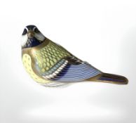 A Royal Crown Derby Great Tit paperweight with silver stopper.