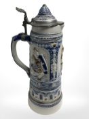 A late 19th century continental pottery pewter mounted beer stein,