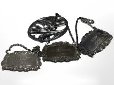 Three silver decanter labels and a further floral brooch, stamped Sterling.