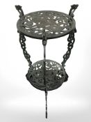 A Celtic design patinated plant stand, height 70 cm.
