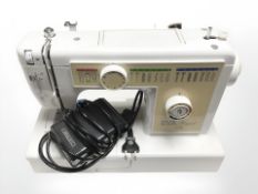 An Eva Royal 2718 electric sewing machine, with pedal and lead.