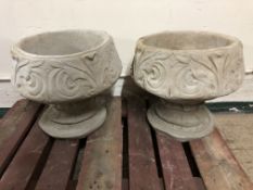 A pair of fleur-de-lys designed urns