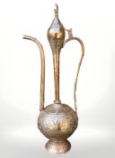 A 19th century copper Bahrain coffee pot, height 52 cm.