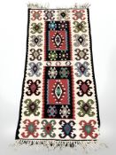 An Eastern flatweave kilim, 110 cm x 52 cm.