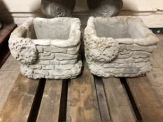 A pair of ivy and brick style planters