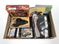 A group of toys including Meccano, Toy Story playing cards, battery operated flying bat toy,