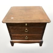 A Stag bedside chest, width 52 cm.