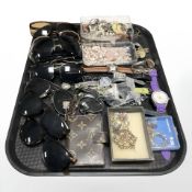 A quantity of sunglasses, lady's and gent's wristwatches, costume jewellery, etc.