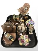 Two wooden bookends, surmounted by ducks, together with a Border Fine Arts figure of three owls,