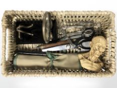 A small wicker basket containing composition anatomical bust, several pairs of scissors,