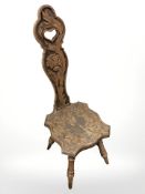 An Arts and Crafts carved walnut spinning chair.