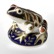 A Royal Crown Derby Frog paperweight, lacking stopper.
