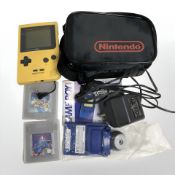 A Nintendo Gameboy Pocket console with bag, lead, games, etc.