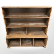 A 20th century Danish teak open bookcase,