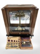 A set of Stanton of London model CB4 lacquered brass scales in glazed mahogany cabinet, width 40 cm,