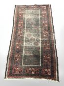 An antique Balouch rug, Afghanistan, 187 cm x 102 cm.