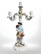 A Meissen-style porcelain three branch figural table candelabrum, height 51 cm.