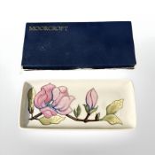A Moorcroft Magnolia rectangular shallow tray, width 20 cm, boxed.