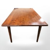 A contemporary stained hardwood dining table, 183 cm x 100 cm x 76 cm.