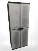 A plastic storage cabinet, 67 cm x 39 cm x 163 cm.
